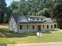 Beautifully designed single-Gathering home with a manicured front lawn at 5431 S Lake Dr, Douglasville, GA 30135
