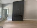 Modern living room showcasing a sleek fireplace and wood flooring at 5431 S Lake Dr, Douglasville, GA 30135
