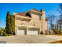 Spacious two-car garage with classic white doors providing ample parking and storage at 1214 Greenridge Ln, Lithonia, GA 30058