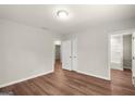 Bright bedroom featuring hardwood floors, neutral walls, and a double door closet at 1030 Westmoor Nw Dr, Atlanta, GA 30314