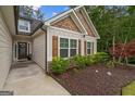 This inviting home boasts well-maintained landscaping and classic shutters, enhancing its curb appeal at 9178 Lakeview Pkwy, Villa Rica, GA 30180