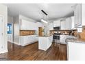 Well-equipped kitchen featuring stainless appliances, granite countertops, and a functional center island at 44 Willow Leaf Way, Sharpsburg, GA 30277
