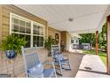 Inviting covered porch with rocking chairs and a porch swing, perfect for relaxing at 75 Barber Rd, Carrollton, GA 30116