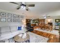Spacious living room featuring a comfortable sofa, wooden floors and decorative wall hangings at 75 Barber Rd, Carrollton, GA 30116
