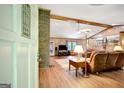 Spacious living room with hardwood floors, brick fireplace, and ample natural light at 9706 Holly Hill Way, Jonesboro, GA 30238