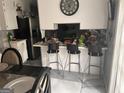 Kitchen view with barstool seating, countertops, and stainless steel appliances at 4514 Tifton Ct, Powder Springs, GA 30127