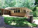 Beautiful home with a brick facade and a well-manicured lawn, perfect for outdoor enjoyment at 205 Avon Dr, Fayetteville, GA 30215