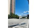 Daytime view of city high rise and road crossing with a bright blue sky at 241 Perimeter Walk, Atlanta, GA 30338