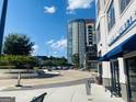 Street view of a parking area and shops at Perimeter homes and lofts at 241 Perimeter Walk, Atlanta, GA 30338