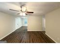 Open-concept living room featuring hardwood floors and a ceiling fan at 604 Thomasville Blvd, Atlanta, GA 30315