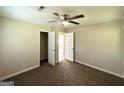 Cozy bedroom with plush carpet, ceiling fan, and convenient closet space at 2469 Baywood Se Dr, Atlanta, GA 30315