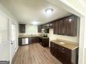 Modern kitchen with granite counters, stainless appliances, and sleek dark wood cabinetry at 2469 Baywood Se Dr, Atlanta, GA 30315
