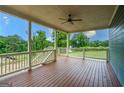 Large porch featuring wood floors, railings, columns, ceiling and a ceiling fan at 1993 Reynolds Sw Dr, Atlanta, GA 30315