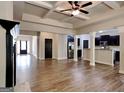 Open-concept living room showcasing vinyl flooring, a modern kitchen, and ample space for entertaining guests at 473 Cherry Creek Dr, Loganville, GA 30052