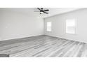 Bright and airy bedroom with a ceiling fan and wood-look flooring at 3725 Saddle Bag Ct, Dacula, GA 30019