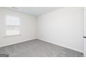 A bedroom featuring carpeted floors and natural light at 3323 Arabian Farm Ln, Dacula, GA 30019
