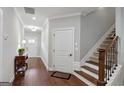 Bright foyer with hardwood floors, staircase, and elegant trim at 3112 Patriot Sq, Marietta, GA 30064
