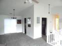 Bright living area with neutral paint, plush carpet, and sliding glass doors at 4651 Garden Hills Dr, Stone Mountain, GA 30083