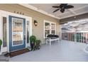 Covered front porch featuring stylish seating and decor, creating an inviting entrance to the home at 1450 Elizabeth Ln, East Point, GA 30344
