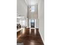 Spacious foyer features soaring ceilings and dark hardwood flooring, creating a grand entrance at 240 Sturry Dr, Mcdonough, GA 30252