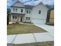 Beautiful two-story home with white siding, covered front porch, and a two-car garage at 149 Silvercrest Dr # 58, Acworth, GA 30101