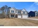 Attractive two-story house with a three-car garage and beautifully landscaped front yard at 112 Felicity Pike, Locust Grove, GA 30248
