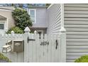 Exterior showing a white fence with black numbers for the house address, mailbox, and the fence details at 2694 Greentree Se Dr, Marietta, GA 30067