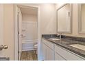 Bathroom features double sinks with granite countertops and a tub/shower combination, providing a functional and stylish space at 506 Alford Cv # 89, Fairburn, GA 30213