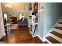 Open-concept living room features hardwood floors, archways, and a cozy fireplace at 1612 Cagle Ct, Lawrenceville, GA 30045