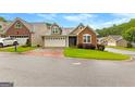 Beautiful home with two-car garage, well-manicured lawn, and inviting curb appeal at 130 Augusta Dr, Peachtree City, GA 30269