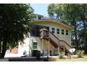 Exterior backyard view showing a deck and a set of stairs at 9342 Carillon Ct, Jonesboro, GA 30236