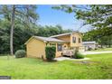Well-maintained two-story home with a lush lawn and a side entry garage at 423 Mephisto Cir, Lawrenceville, GA 30046