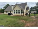 Well maintained backyard featuring a fence, a patio area, a grill, and a home exterior at 521 Deadwood Trl, Locust Grove, GA 30248