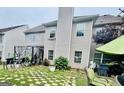 A backyard featuring a patio with outdoor seating and well-maintained landscaping around the perimeter at 12402 Muir Field Ct, Fayetteville, GA 30215