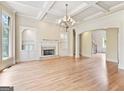 Spacious living room with coffered ceilings, fireplace, and built-in shelving at 6205 Arnall Nw Ct, Acworth, GA 30101