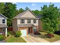 Charming two-story home featuring a brick facade and well-manicured front lawn at 11755 Lovejoy Crossing Blvd, Hampton, GA 30228