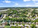 Expansive aerial view of the neighborhood, showcasing the community, trees and houses at 1504 Oglethorpe Dr, Suwanee, GA 30024