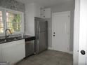 Efficient kitchen layout with stainless steel appliances and ample counter space at 1876 Sw Sandtown Sw Rd, Atlanta, GA 30311