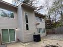 A two-story house boasts a neutral exterior with various sized windows at 7560 Taylor Rd # 1, Riverdale, GA 30274