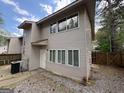 Two-story home boasts a neutral exterior with multiple windows at 7560 Taylor Rd # 1, Riverdale, GA 30274