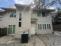 Two-story house features a neutral exterior and a well-maintained front yard at 7560 Taylor Rd # 1, Riverdale, GA 30274