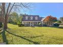 Charming one-story home with a well-manicured lawn and mature landscaping at 100 Clydesdale Ct, Tyrone, GA 30290