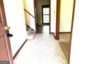 View of Foyer with tile flooring and staircase at 8832 Twin Oaks Dr, Jonesboro, GA 30236