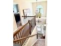 Elegant foyer with staircase, chandelier, and view into a bedroom at 558 Hideaway Dr, Jonesboro, GA 30238