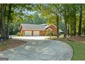 Spacious home featuring a circular driveway and a two-car garage at 1000 Turner Church Rd, Mcdonough, GA 30252
