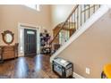 Spacious foyer with hardwood floors, staircase, and decorative details at 150 Bellemeade Ct, Fayetteville, GA 30215