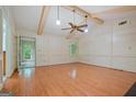 Bright living room with hardwood floors, wainscoting and large windows that provide ample light at 1977 Kensington High Sw St, Lilburn, GA 30047