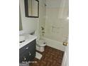 Standard bathroom with a shower-tub combination, toilet, and vanity sink at 115 Lakeview Dr, Stockbridge, GA 30281