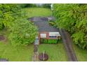 Aerial view of the home with lush greenery, mature trees, and a well-kept lawn at 109 Stockbridge Rd, Jonesboro, GA 30236