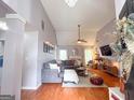 Large living room with modern decor, fireplace, and hardwood floors at 329 Royal Crescent Way, Stockbridge, GA 30281
